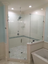 hexagonal framed shower enclosure with thick glass and swinging door