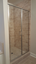 swinging glass shower doors with arched top and decorative glass